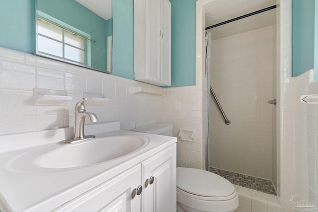 bathroom featuring curtained shower, vanity, tile walls, and toilet