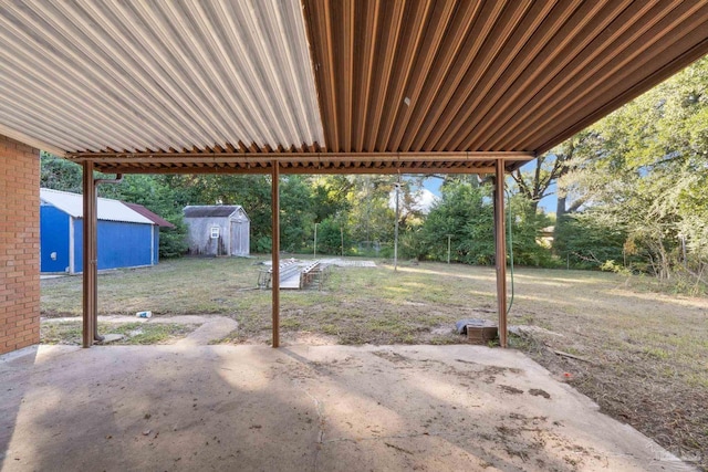 view of patio / terrace with a shed