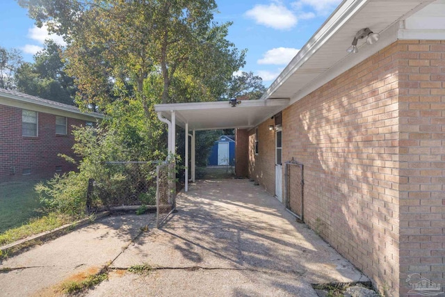 exterior space with a carport and a shed