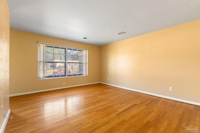 unfurnished room featuring light wood-type flooring