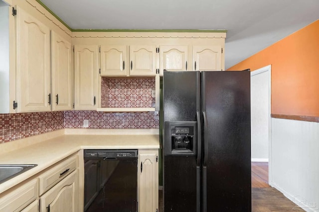 kitchen with backsplash, dark hardwood / wood-style flooring, and black appliances