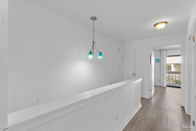 corridor featuring light hardwood / wood-style floors