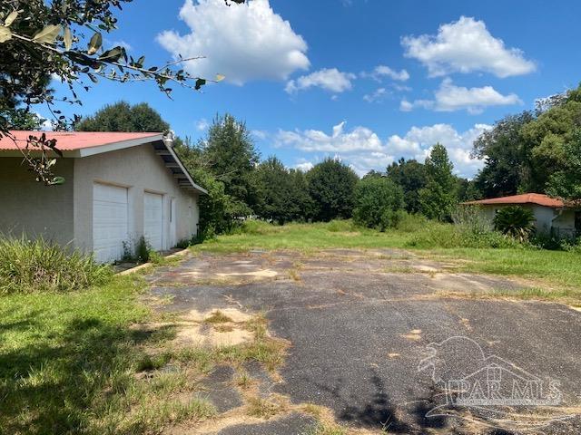 view of yard featuring a garage