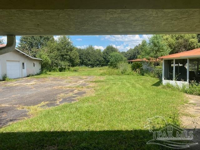 view of yard with a sunroom