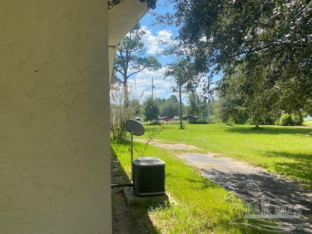 view of yard with central AC