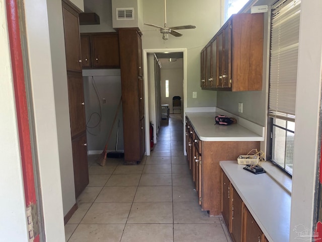 kitchen featuring ceiling fan and light tile patterned floors