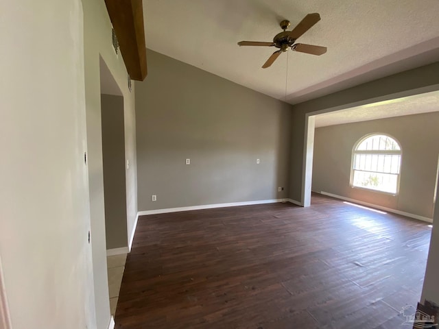 empty room featuring a textured ceiling, dark hardwood / wood-style flooring, and ceiling fan