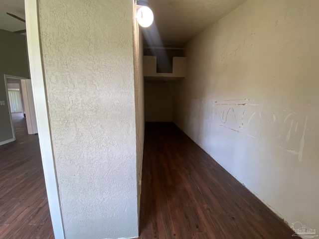 corridor featuring dark wood-type flooring