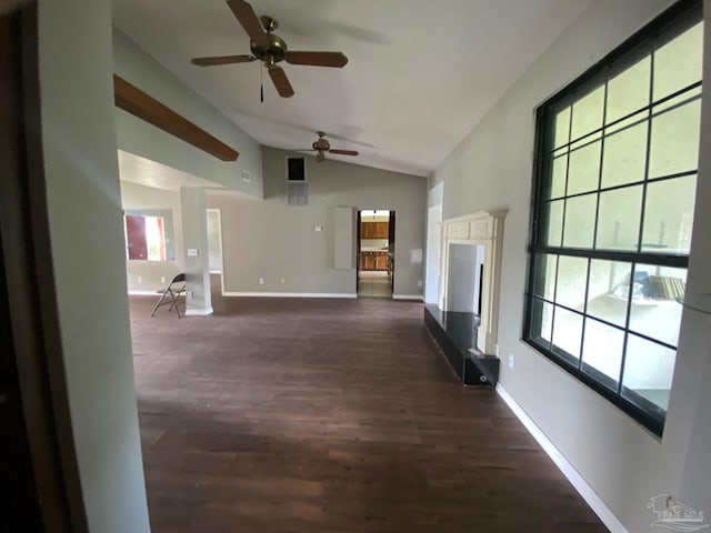 unfurnished living room with lofted ceiling, ceiling fan, plenty of natural light, and dark hardwood / wood-style flooring