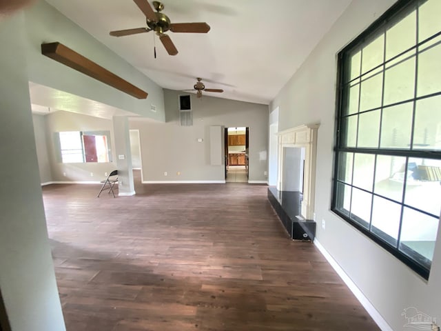 unfurnished living room with lofted ceiling, ceiling fan, and dark hardwood / wood-style flooring