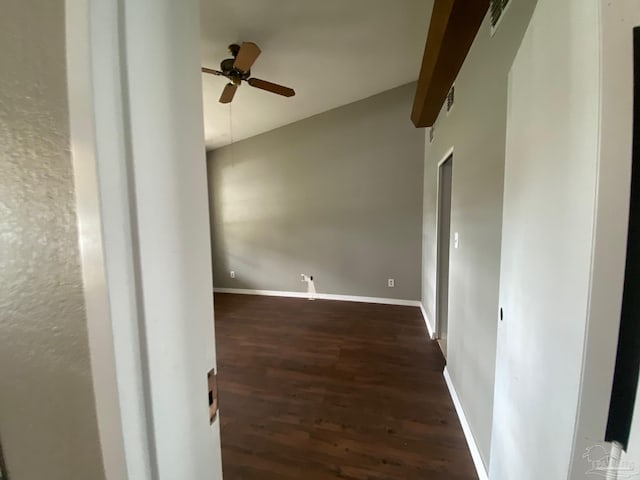 empty room featuring dark hardwood / wood-style flooring and ceiling fan