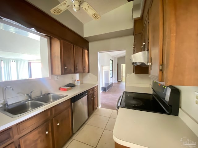 kitchen featuring stove, ceiling fan, range hood, stainless steel dishwasher, and sink