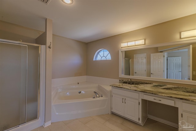 bathroom with vanity, tile patterned flooring, a bath, and a shower stall