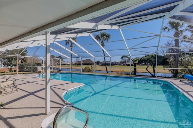 pool with a lanai and a patio area