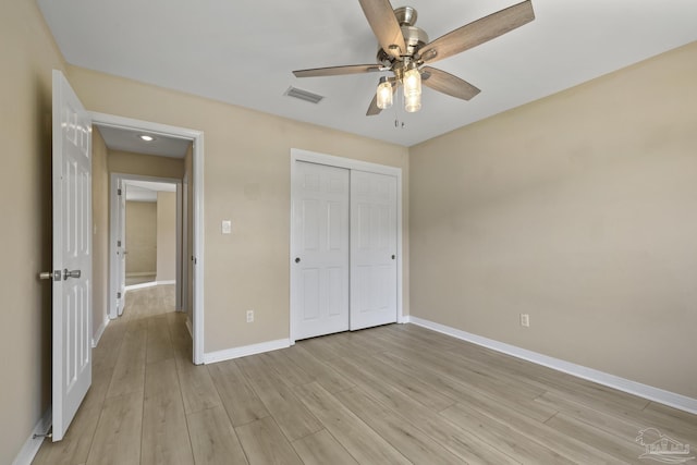 3729 Tiger Point Blvd, Gulf Breeze, FL 32563 - unfurnished bedroom featuring baseboards, light wood-style flooring, a closet, and ceiling fan