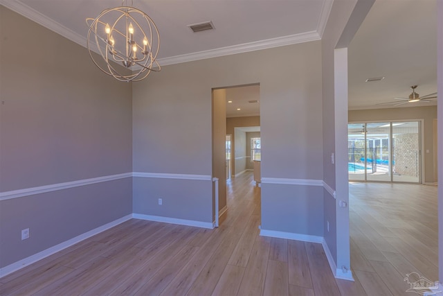 empty room with light wood-type flooring, visible vents, and crown molding