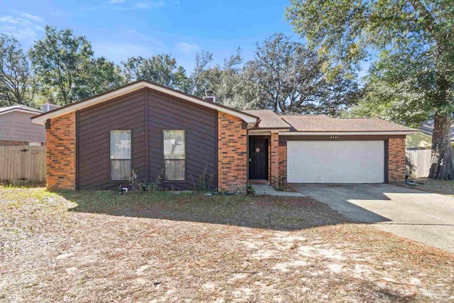 ranch-style house featuring a garage