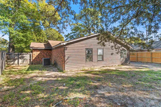 back of property featuring a lawn