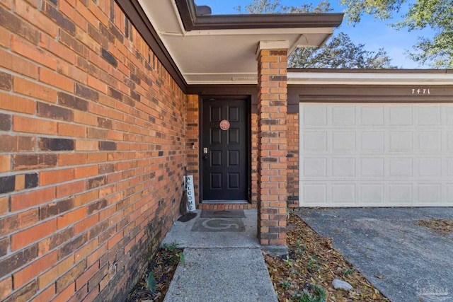 doorway to property featuring a garage