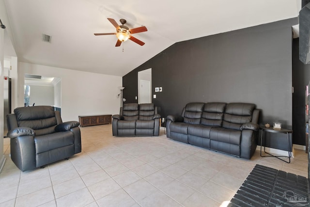 tiled living room featuring ceiling fan and lofted ceiling