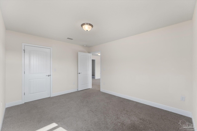 unfurnished bedroom featuring carpet