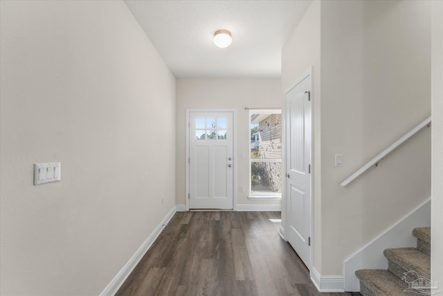 entryway with dark hardwood / wood-style floors