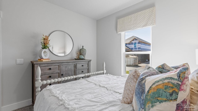 9869 Starling Dr, Pensacola, FL 32506 - bedroom with baseboards and carpet