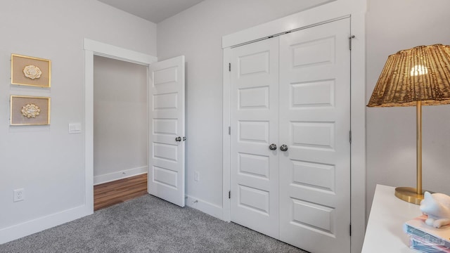 9869 Starling Dr, Pensacola, FL 32506 - bedroom featuring carpet, a closet, and baseboards