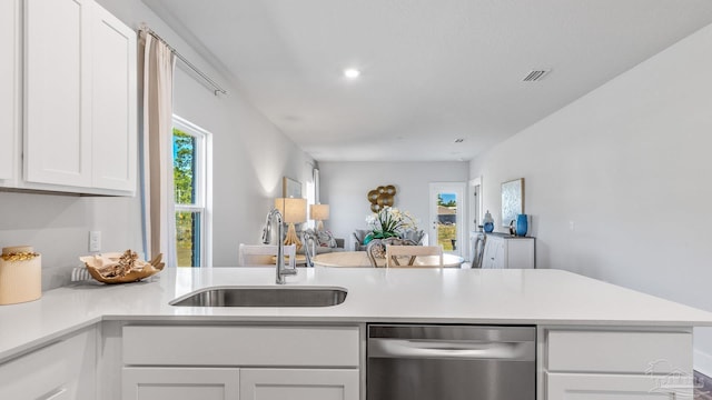 9869 Starling Dr, Pensacola, FL 32506 - kitchen with dishwasher, a sink, open floor plan, white cabinetry, and light countertops