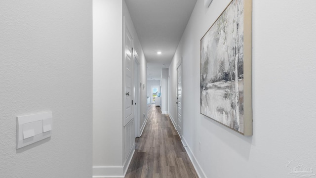9869 Starling Dr, Pensacola, FL 32506 - hallway featuring dark wood-style flooring, recessed lighting, and baseboards