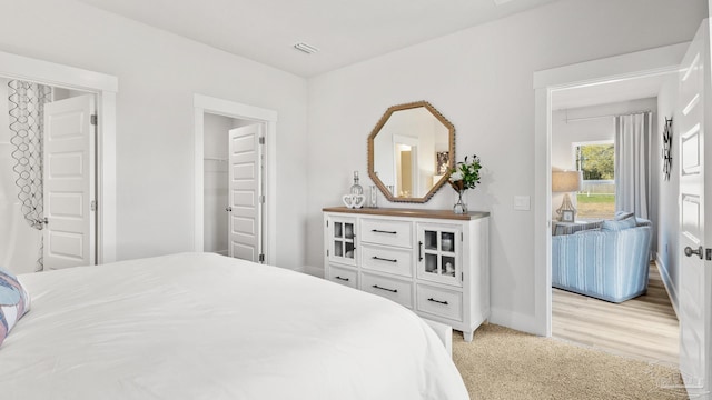 9869 Starling Dr, Pensacola, FL 32506 - bedroom with baseboards and light carpet