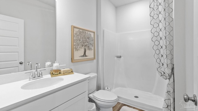 9869 Starling Dr, Pensacola, FL 32506 - bathroom with a shower stall, toilet, and vanity