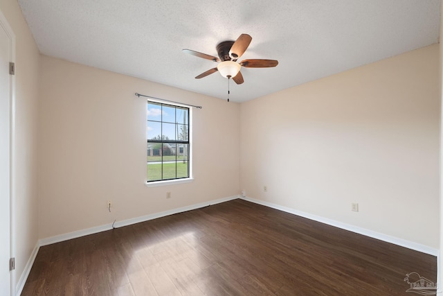 unfurnished room featuring dark wood-style floors, a textured ceiling, baseboards, and ceiling fan