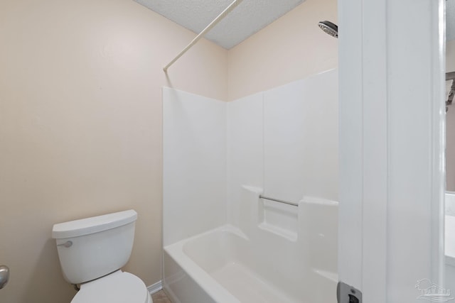 bathroom with a textured ceiling, toilet, a shower, and a tub to relax in