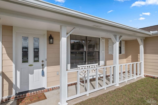 entrance to property with covered porch