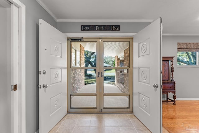 doorway featuring ornamental molding and light tile patterned flooring