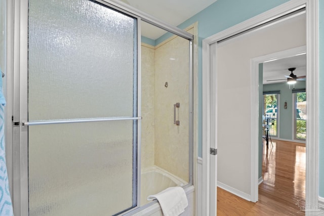 bathroom featuring wood finished floors and baseboards