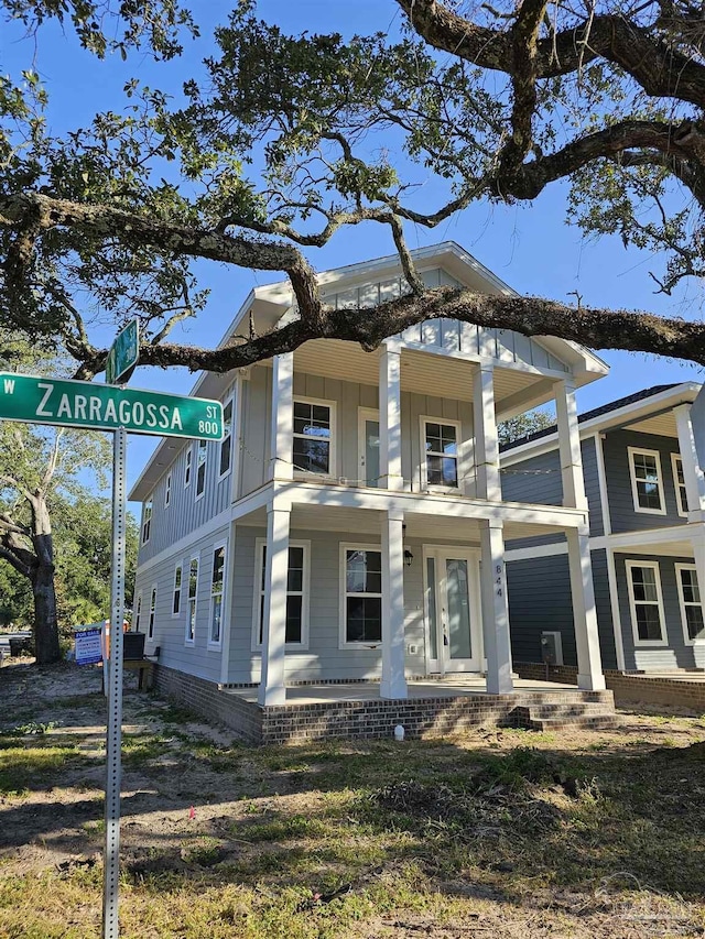 view of front of home with a balcony