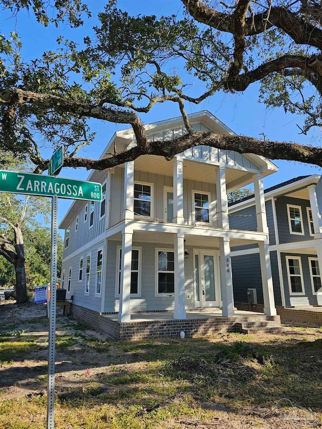 view of front of home with a balcony