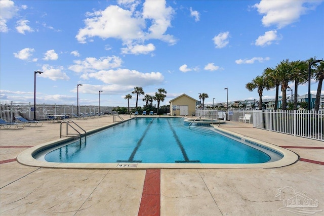 view of swimming pool with a patio