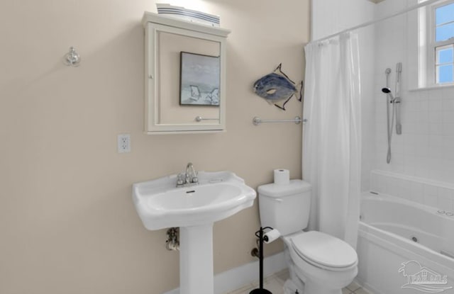 bathroom featuring toilet and shower / bath combo with shower curtain