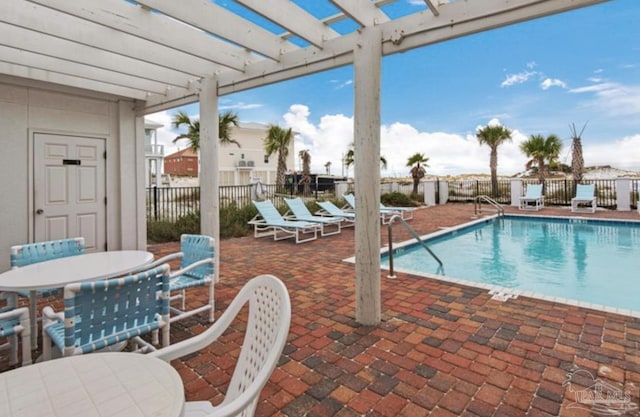 view of swimming pool with a pergola and a patio