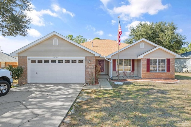 ranch-style home featuring a garage and a front yard