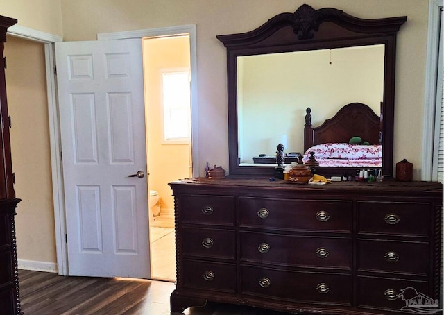 bedroom featuring wood-type flooring and connected bathroom