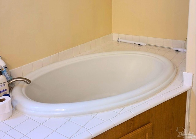 bathroom featuring a relaxing tiled tub