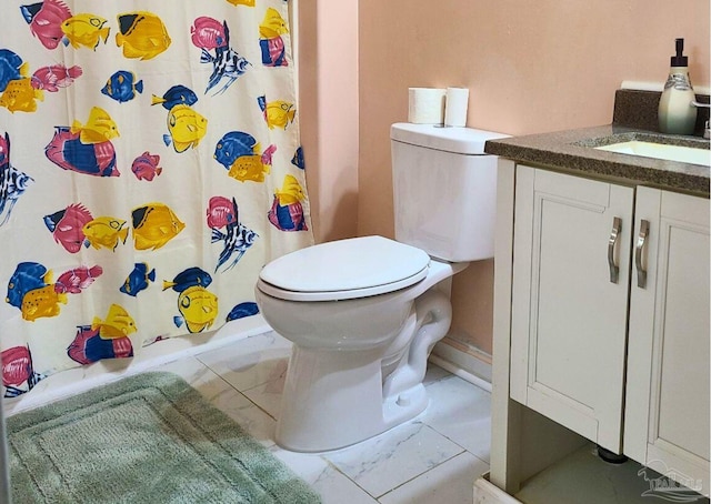 bathroom with vanity, toilet, and walk in shower