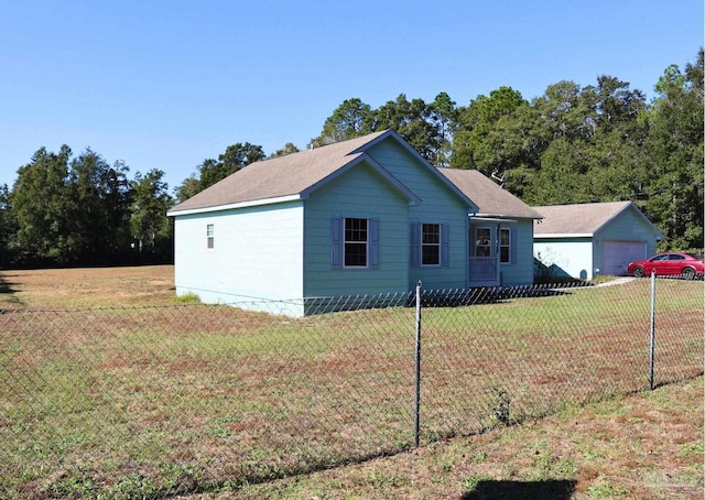 view of home's exterior featuring a yard and a garage