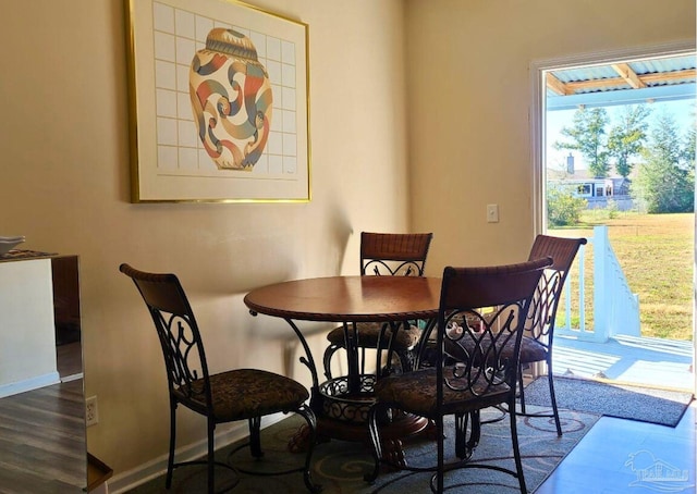 dining space with dark wood-type flooring