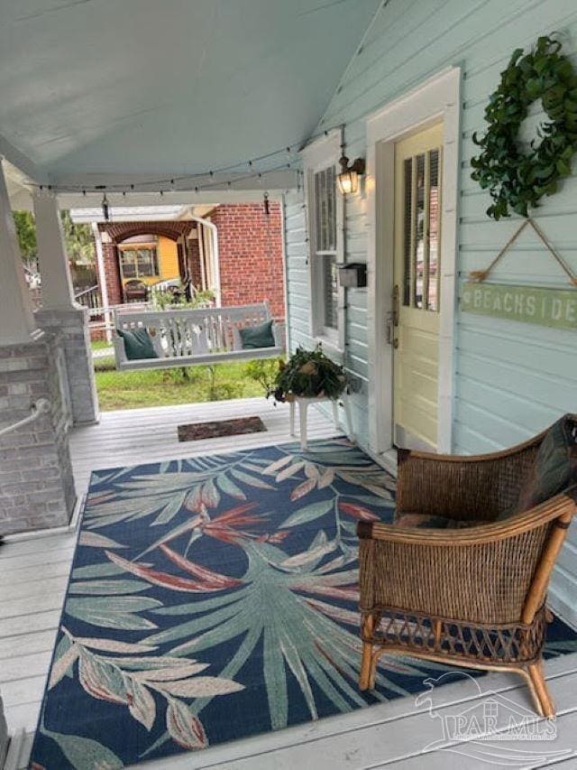 wooden terrace with covered porch