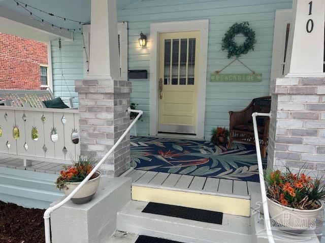 doorway to property featuring a porch